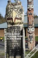 Black Bear Holds A Hole In His Paws