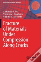 Fracture Of Materials Under Compression Along Cracks