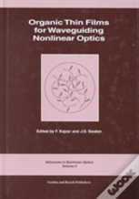 Organic Thin Films For Waveguiding Nonlinear Optics