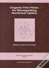 Organic Thin Films For Waveguiding Nonlinear Optics